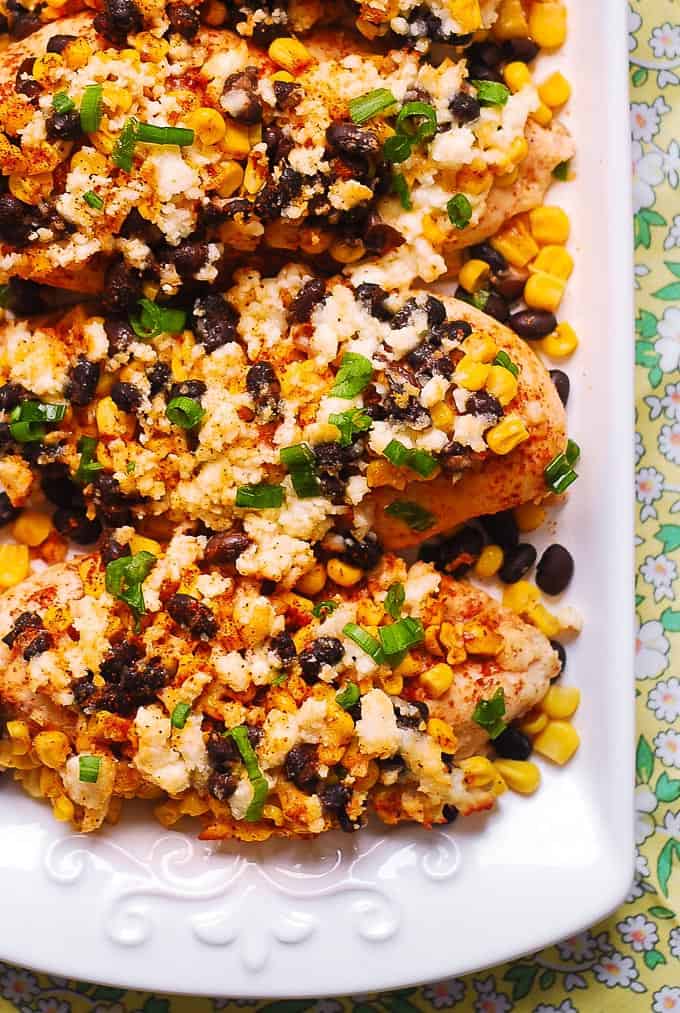 Mexican Street Corn Black Bean Chicken Bake with Cotija Cheese, Chili Powder on a white plate