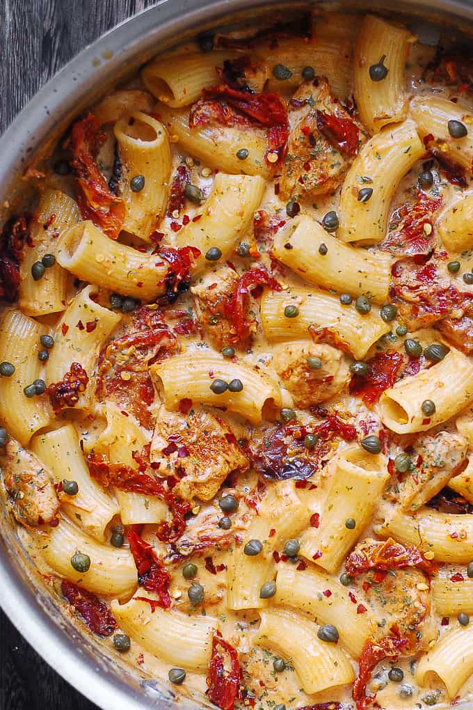 Rigatoni Pasta with Chicken and Capers in a creamy Mozzarella cheese sauce with garlic, sun-dried tomatoes, capers, dried basil, red pepper flakes, cream or half and half