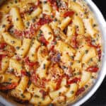 Rigatoni Pasta with Chicken, Capers, and creamy pasta sauce made with sun-dried tomatoes, garlic, cream or half and half, Mozzarella cheese