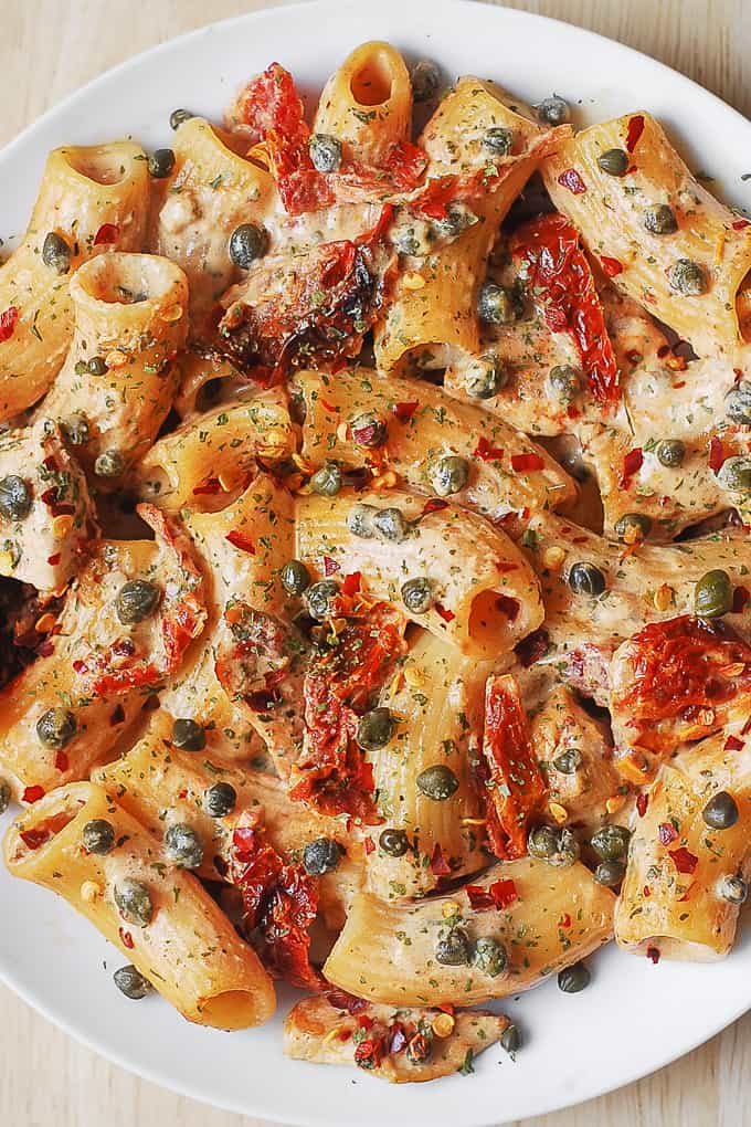 Rigatoni Pasta with Chicken and Capers in a creamy Mozzarella cheese sauce with garlic, sun-dried tomatoes, capers, dried basil, red pepper flakes, cream or half and half