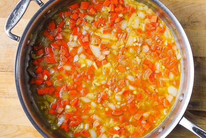 add broth to the skillet with carrots and onions