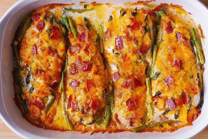 asparagus chicken bake with bacon and ranch in a white casserole dish