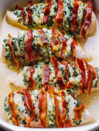 hasselback chicken with cream cheese, mozzarella, parmesan, spinach, and bacon