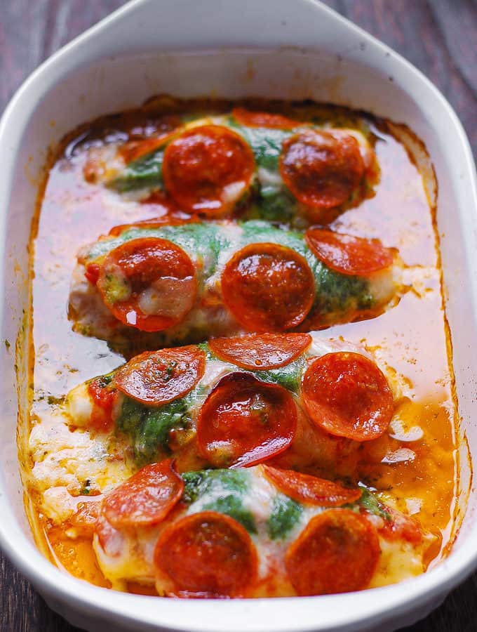 Pepperoni Chicken with Basil Tomato Sauce and Mozzarella in a white casserole dish