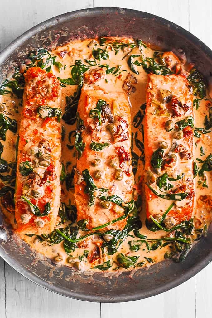 Creamy Tuscan Salmon with Spinach, Artichokes, Garlic, and Capers