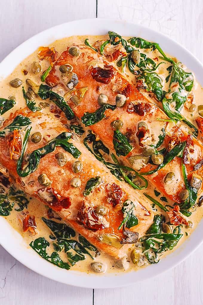 Creamy Tuscan Salmon with Spinach, Artichokes, Garlic, and Capers