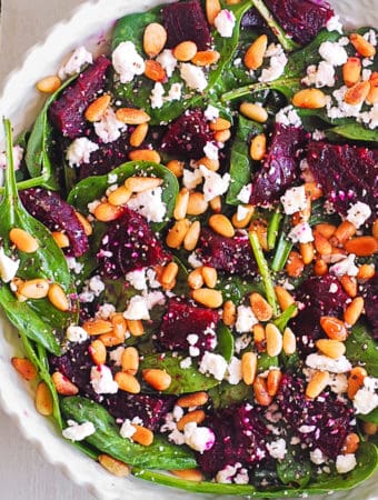 simple beet salad with goat cheese - in a white bowl.