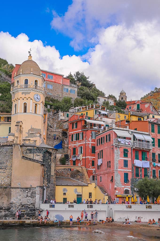 View of older watch tower and other colorful buildings in Cinque Terre