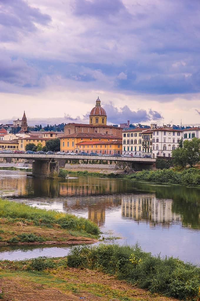 View of buildings and a bridge over the river in Florence, Italy