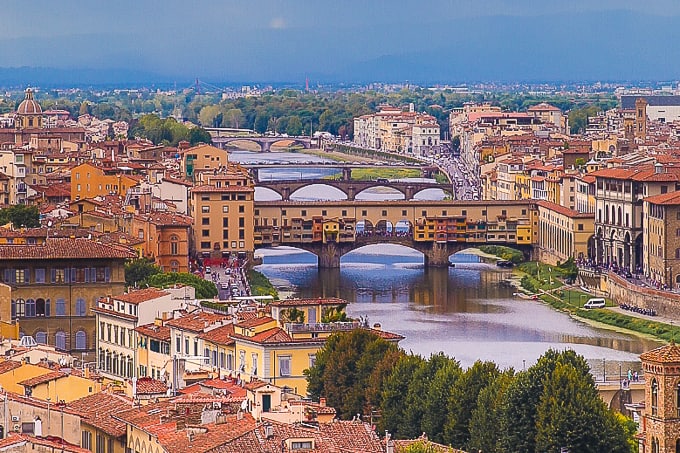 View of bridges, river, buildings in Florence, Italy