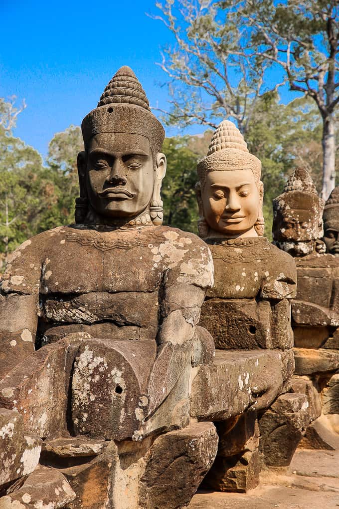 stone figures of mythical beings at the South gate of Angkor Thom, Cambodia