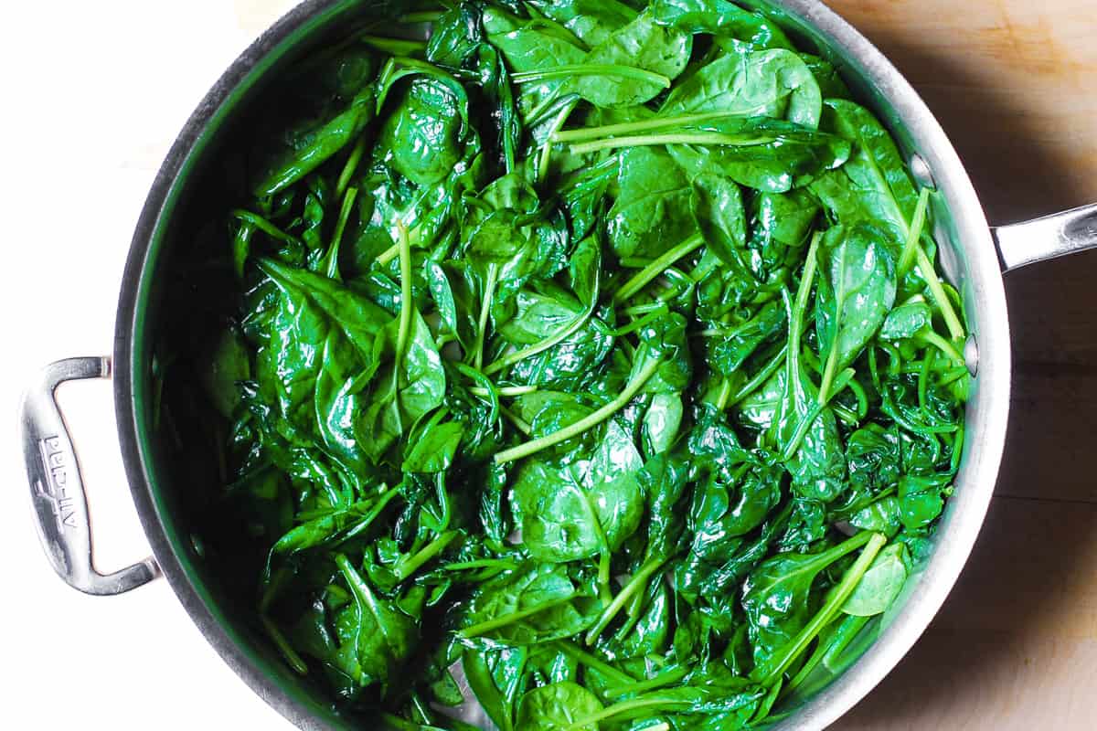 cooked spinach (without cream or cheese) in a stainless steel pan
