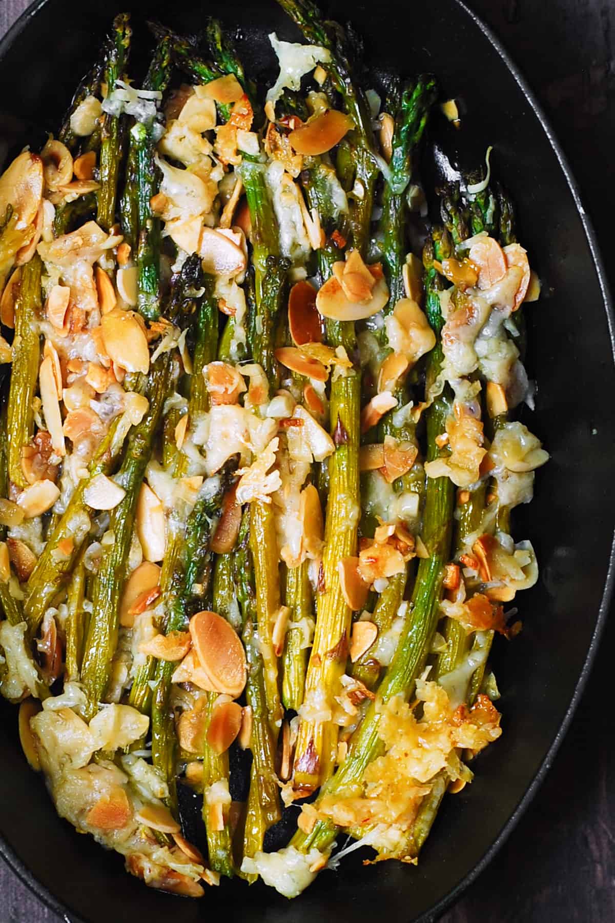 Asparagus with Almonds and Parmesan in a cast-iron pan