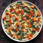 Creamy Ground Turkey Pasta with Butternut Squash and Spinach on a white plate