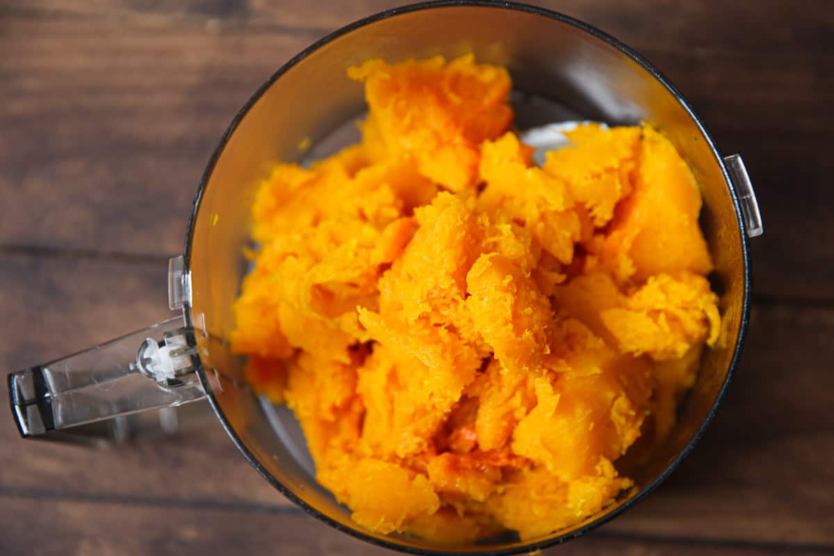 cooked butternut squash in a food processor