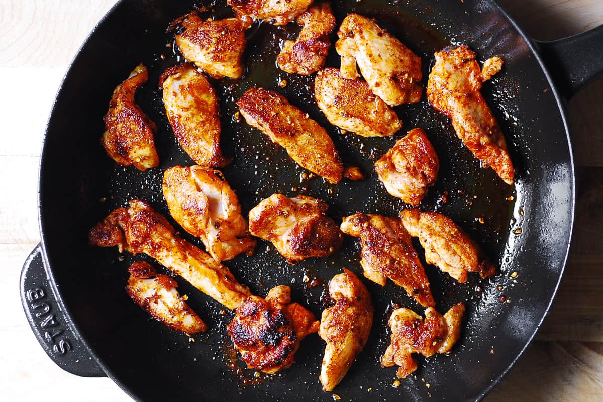 seared sliced chicken in a cast-iron skillet