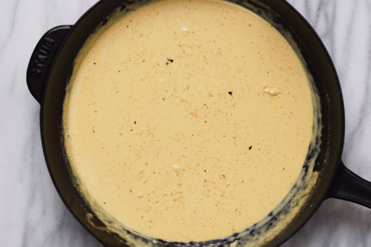 creamy sauce in a cast-iron skillet