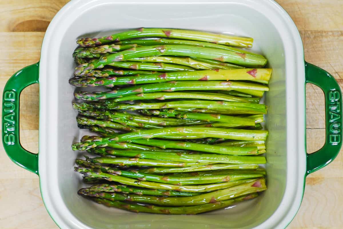 trimmed asparagus in a baking dish
