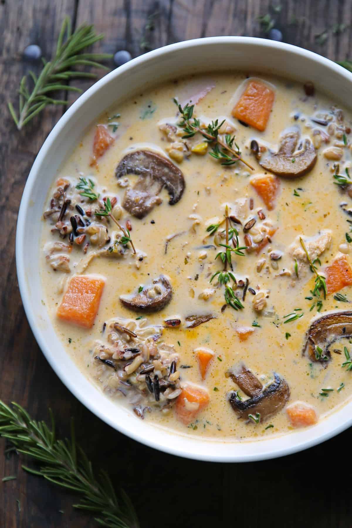 Creamy Chicken and Wild Rice Soup with Mushrooms in a white bowl