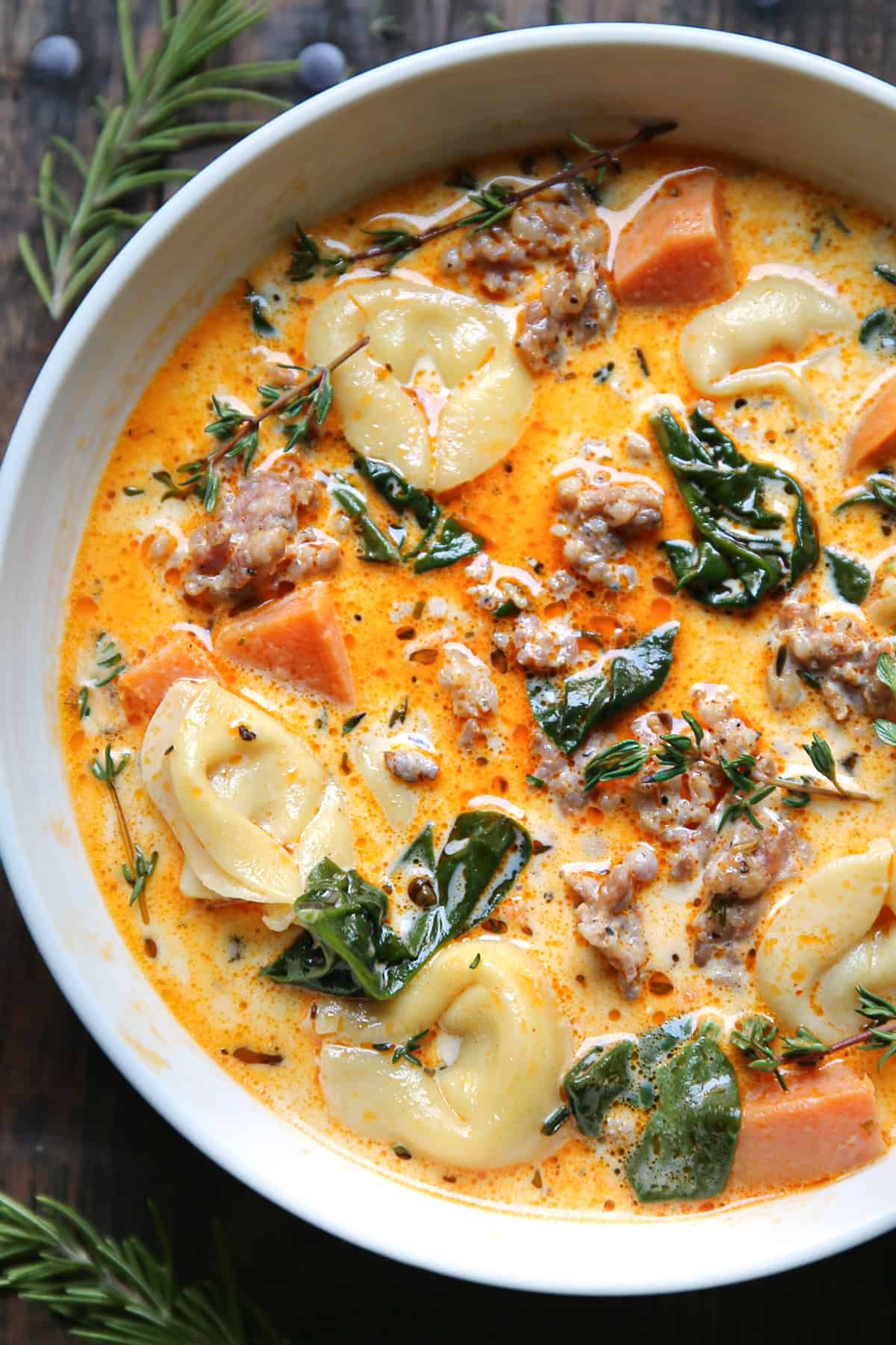 Sausage Tortellini Soup in a white bowl.