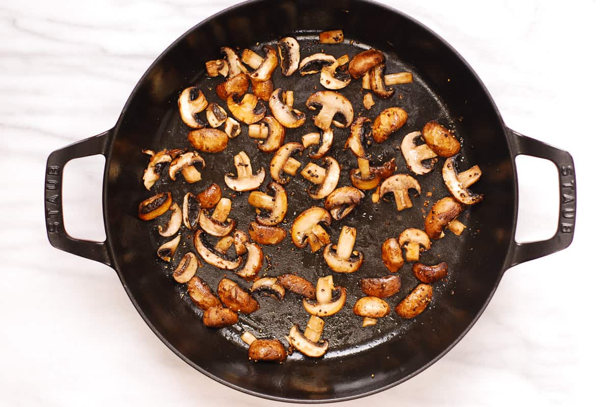 cooked mushrooms in a cast-iron pan
