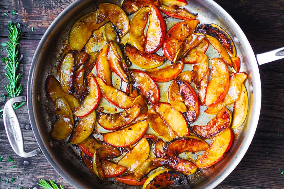 sauteed apples glazed with honey in a skillet
