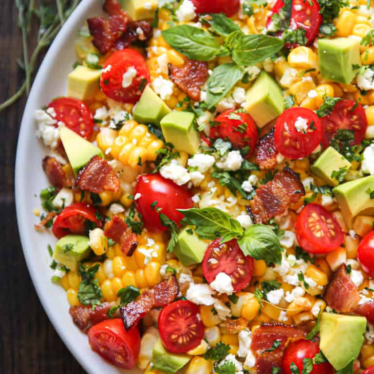 Avocado Corn Tomato Salad with Creamy Cilantro-Lime Dressing on a plate