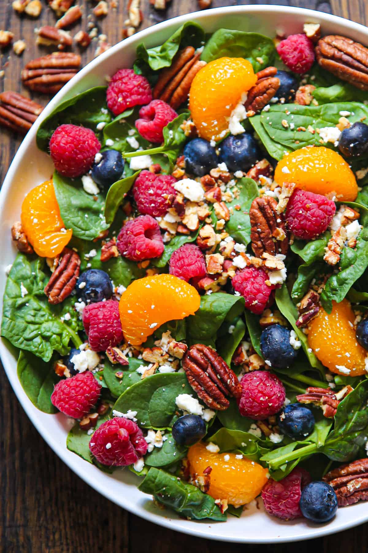 berry spinach salad with blueberries, raspberries, pecans, feta cheese