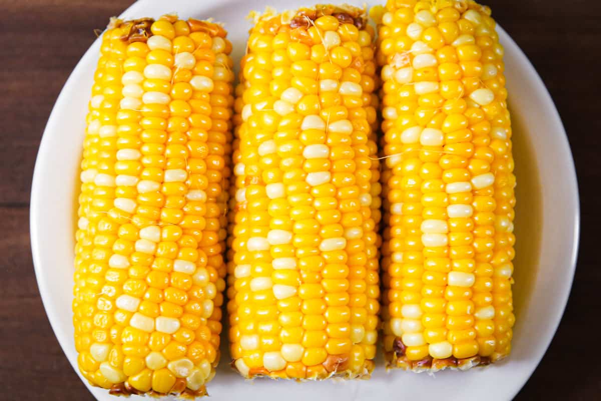 cooked corn on the cob on a plate