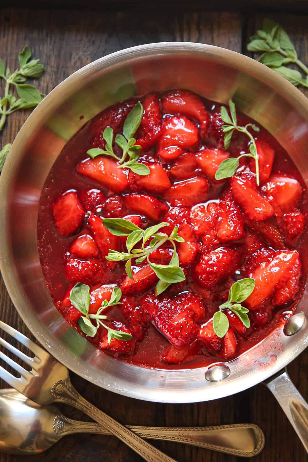 cooked strawberries in as stainless steel skillet