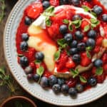 Baked Brie with Strawberries and Blueberries on a plate