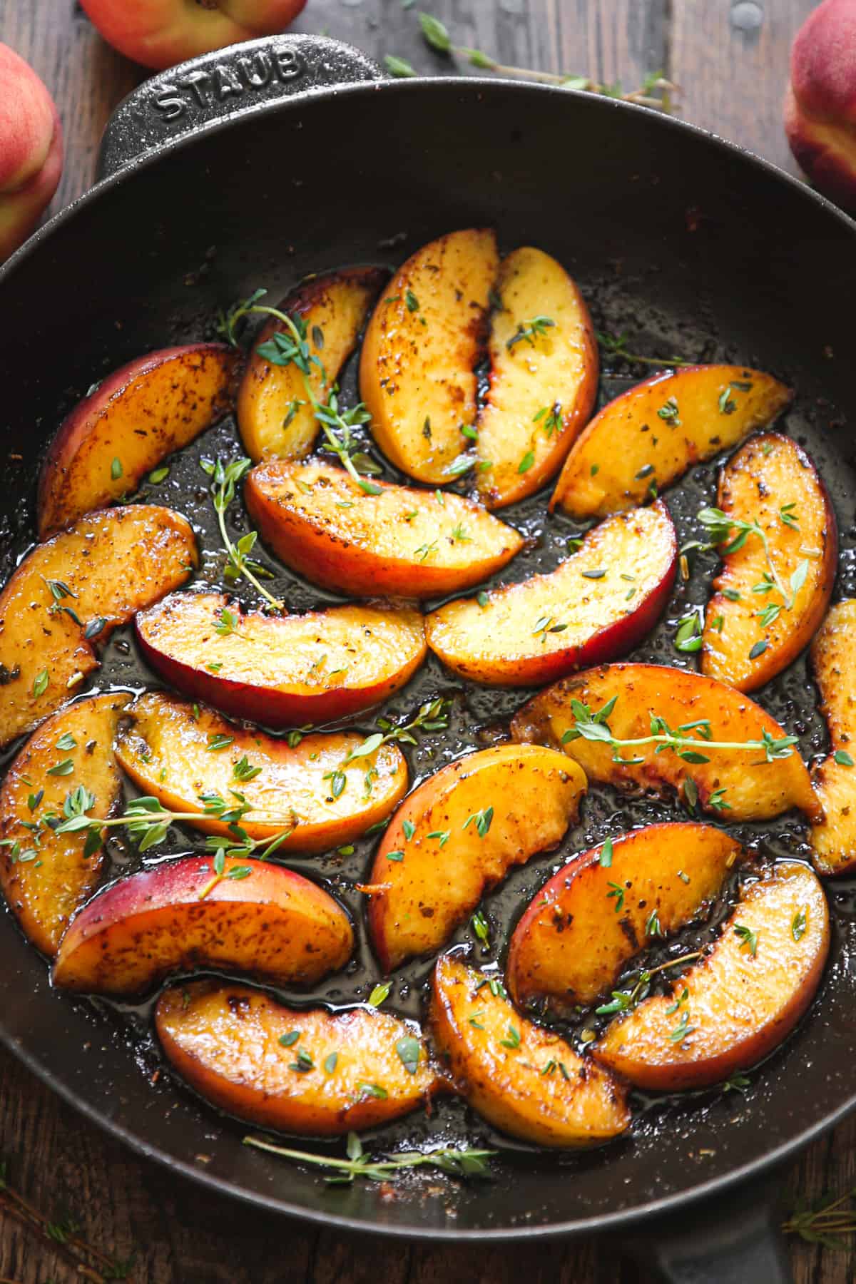 cooked peaches in a cast iron pan