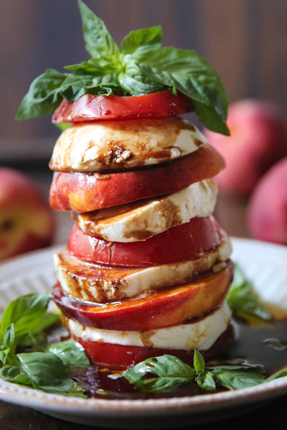 Peach Tomato Caprese Salad with Basil, Balsamic Glaze, and Olive oil (a stack)