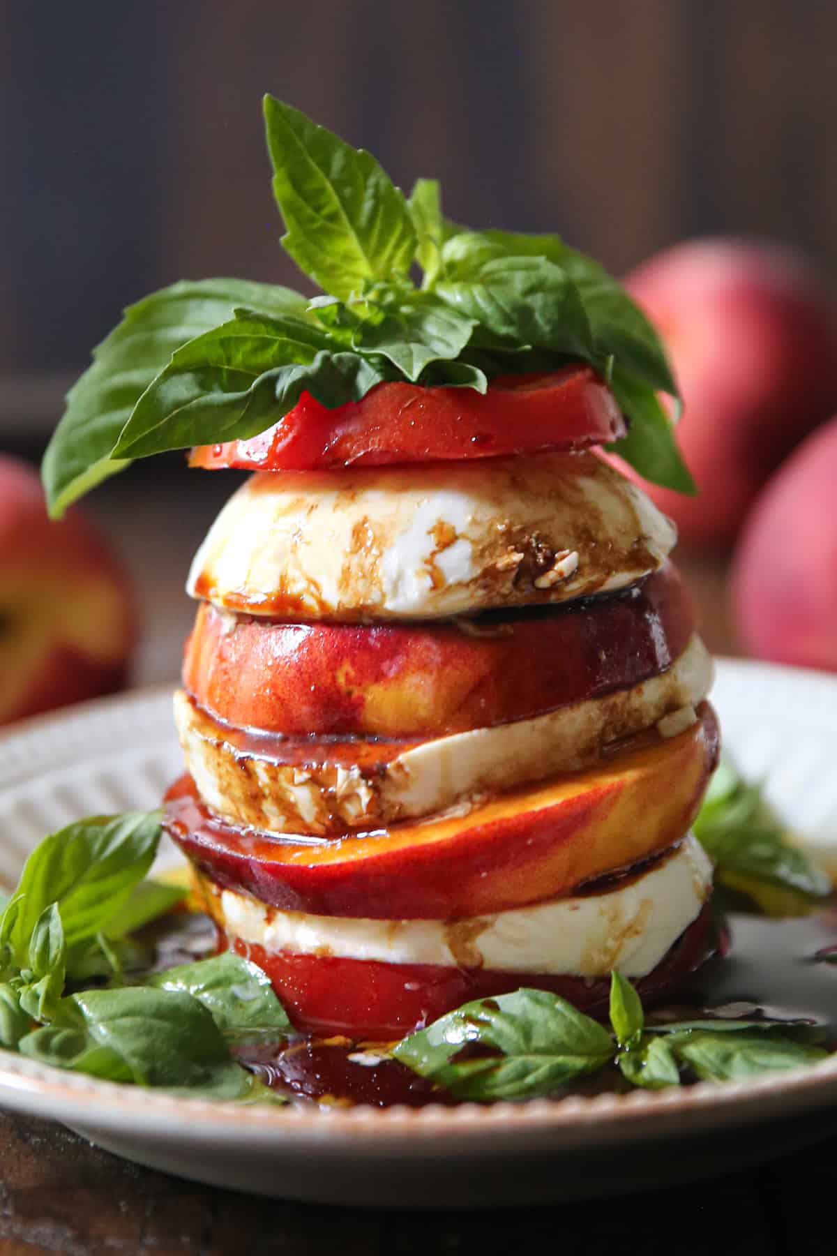 Peach Tomato Caprese Salad with Basil, Balsamic Glaze, and Olive oil (a stack)