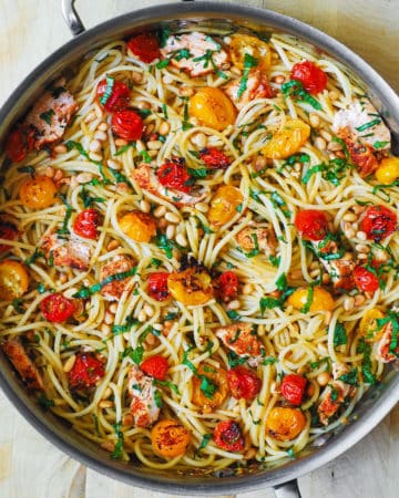 Pasta with Roasted Cherry Tomatoes, Chicken, and Lemon Garlic Butter Sauce in a stainless steel pan