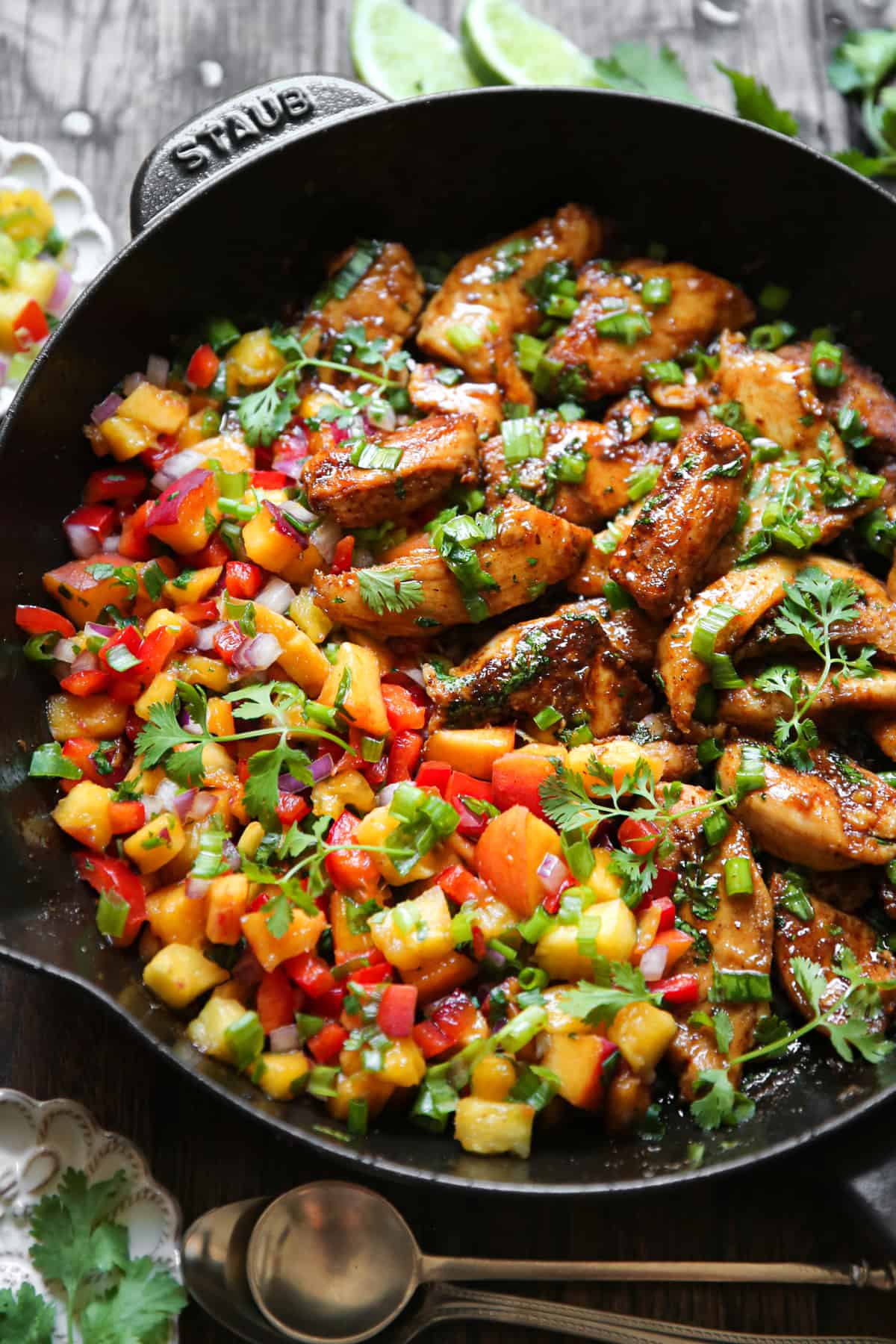 Cilantro-Lime Chicken with Peach Salsa in a cast iron skillet