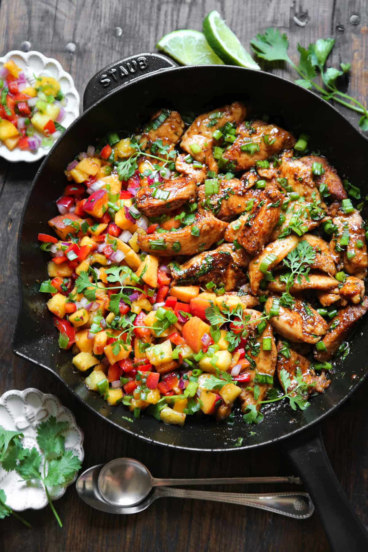 Cilantro-Lime Chicken with Peach Salsa in a cast-iron skillet