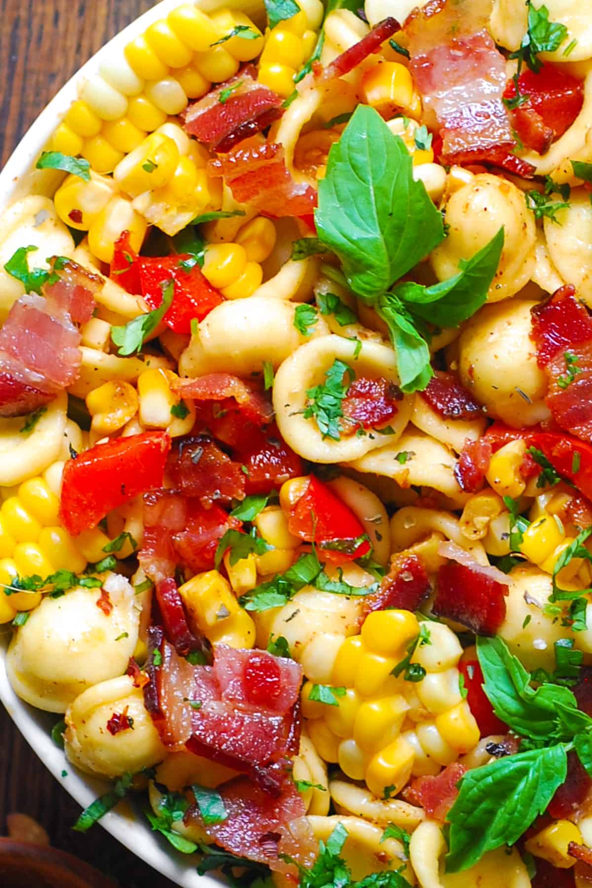 Corn Pasta Salad with Bacon and Creamy Pesto Dressing in a bowl