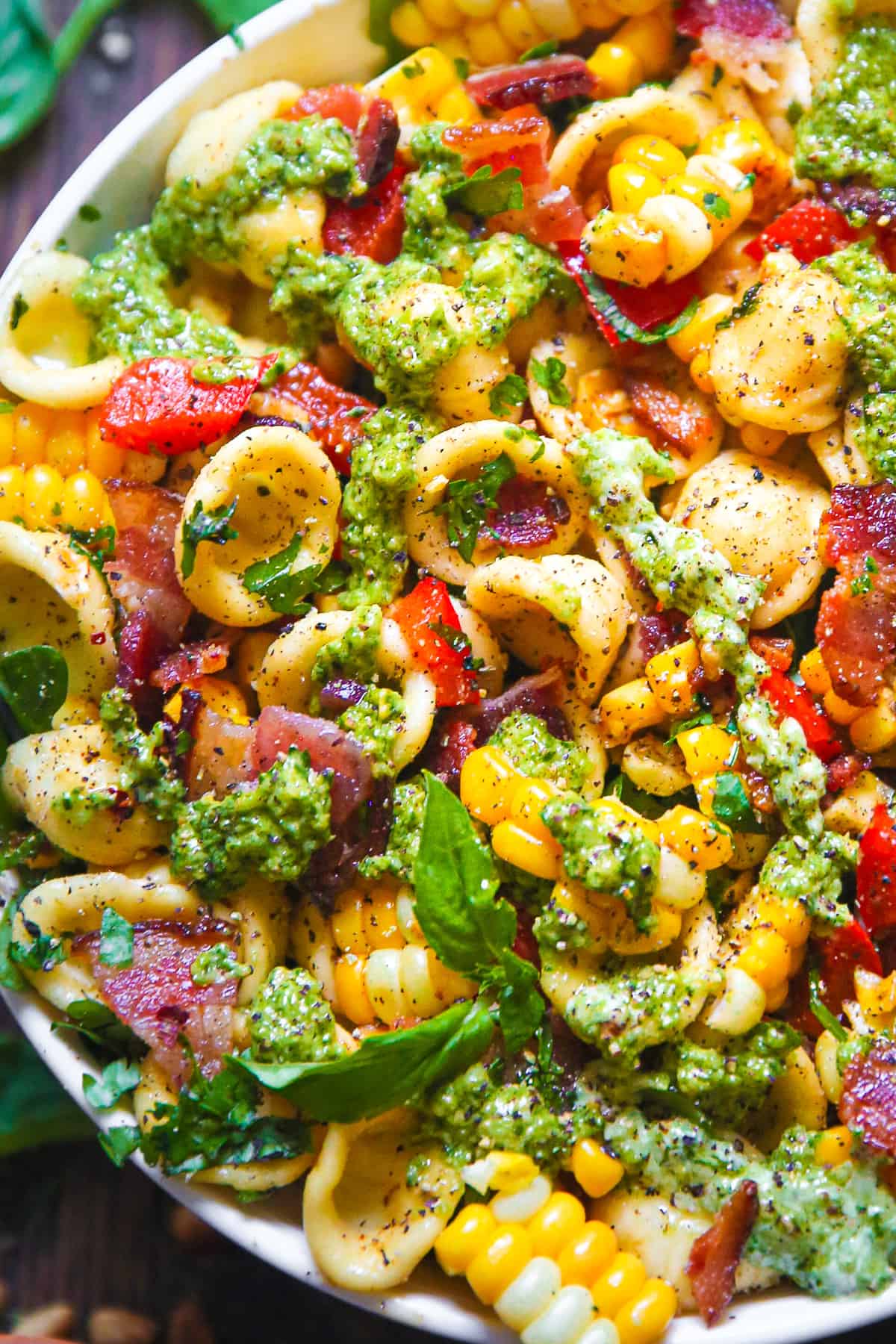 Corn Pasta Salad with Bacon and Creamy Pesto Dressing in a bowl