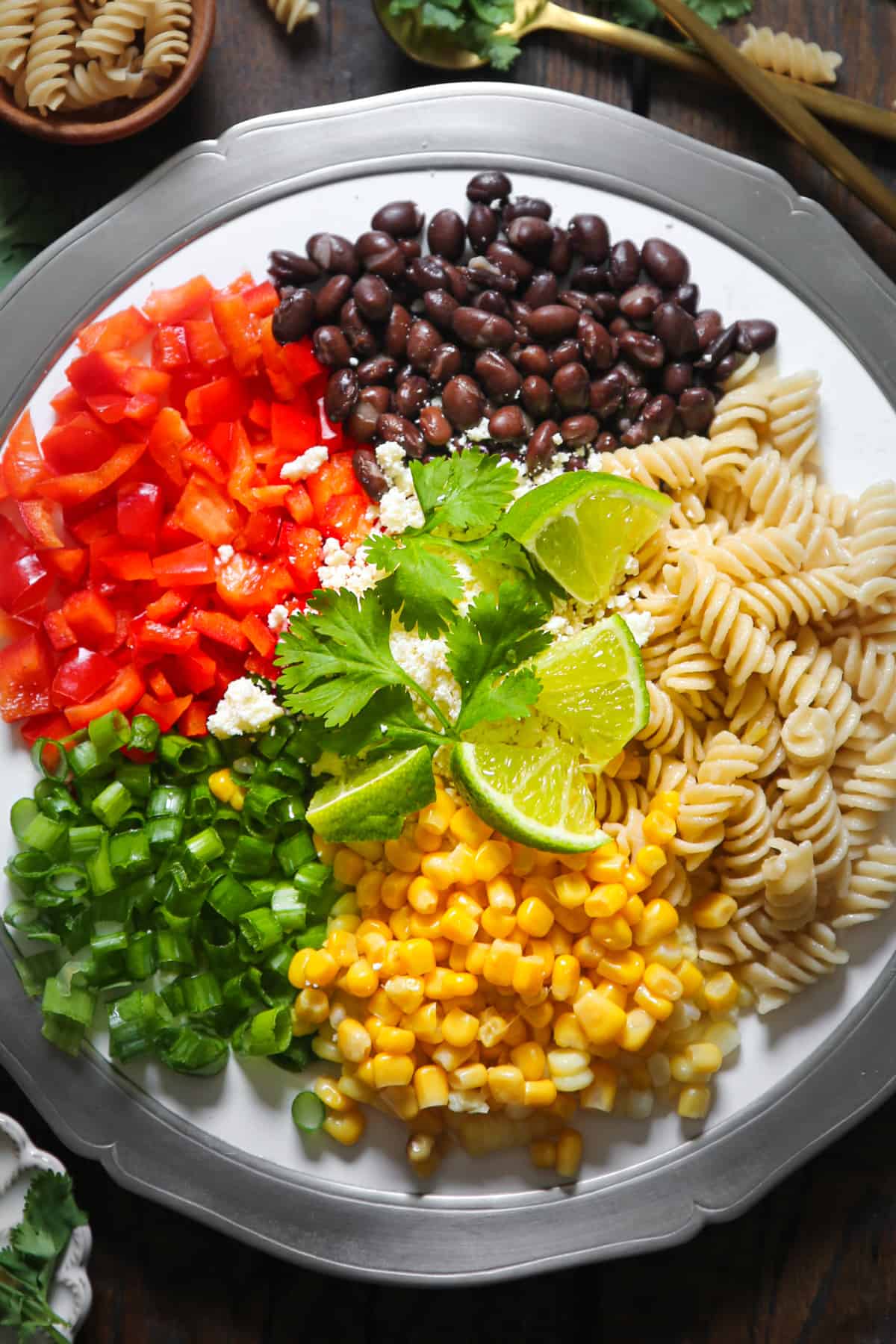 Ingredients for Mexican Street Corn Pasta Salad on a plate