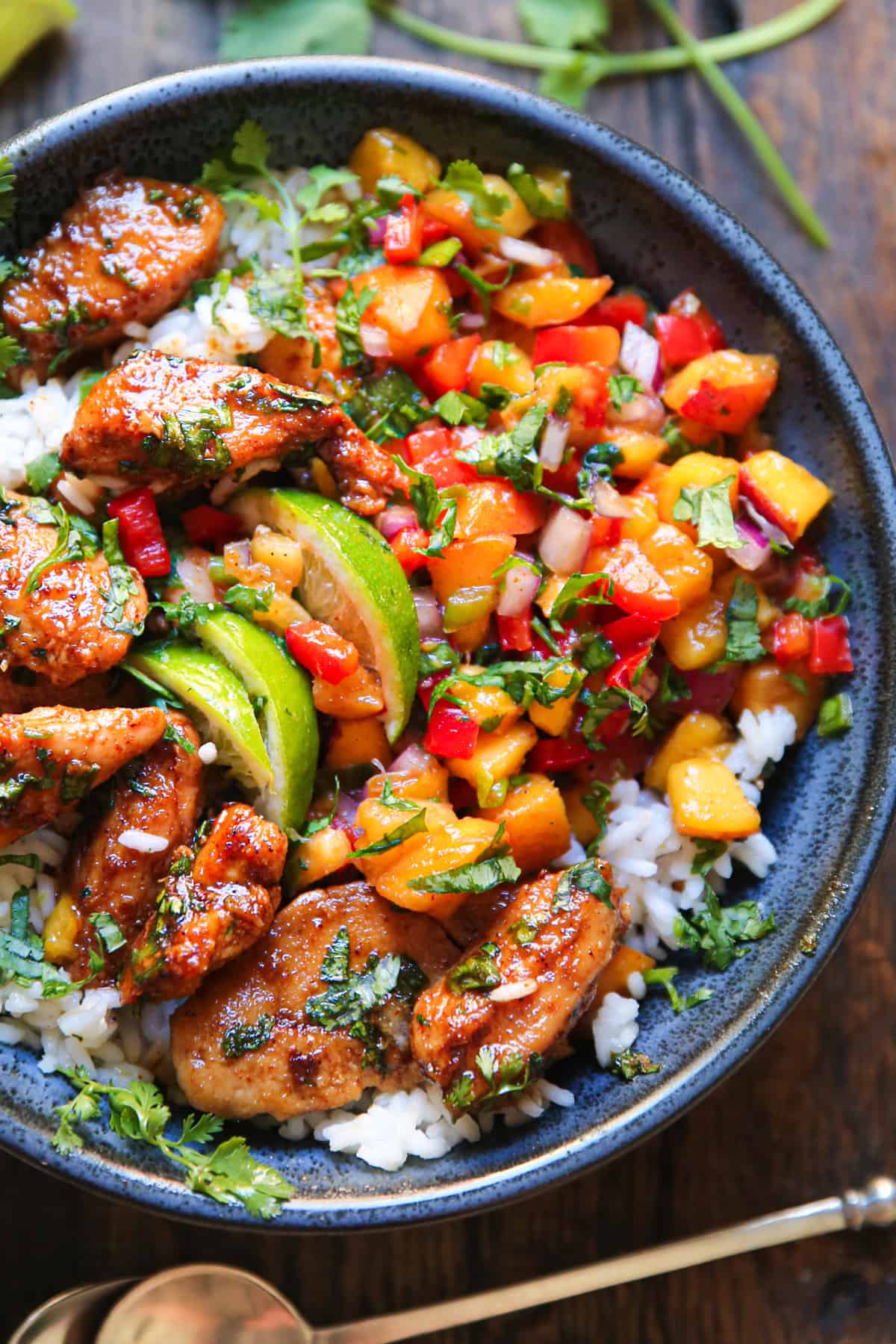 Cilantro-Lime Chicken with Peach Salsa and Rice in a blue bowl