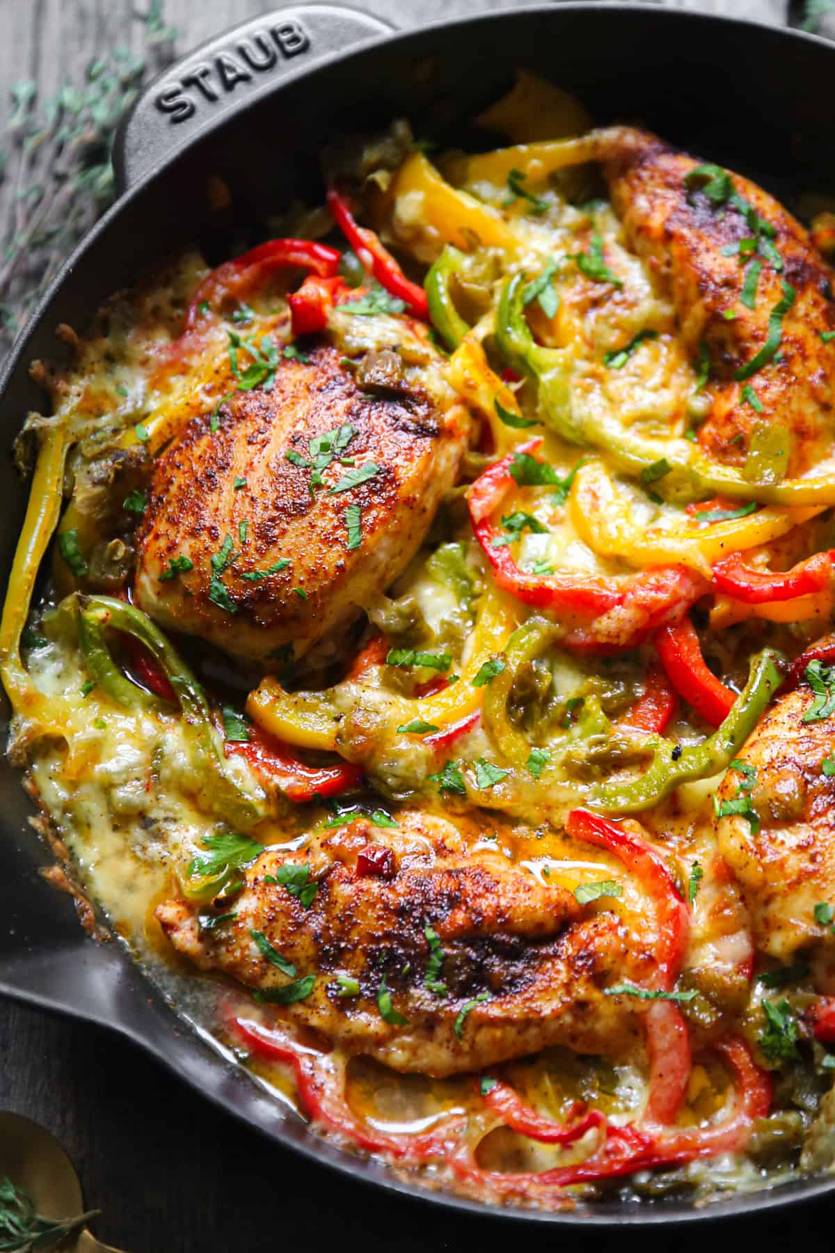 chicken fajita bake with bell peppers in a cast iron skillet