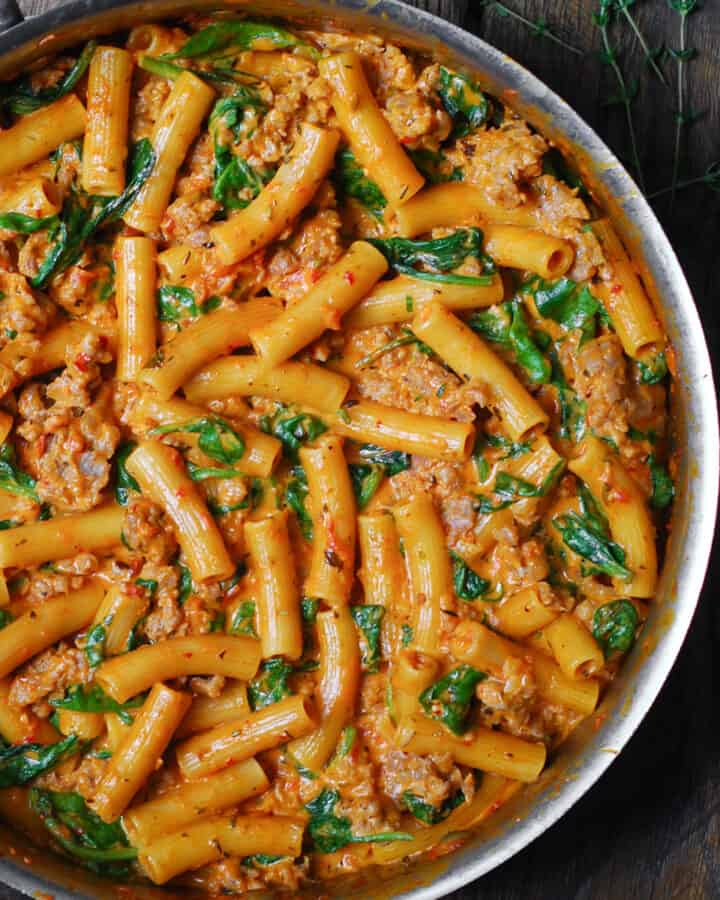 Creamy Sausage Rigatoni - in a stainless steel pan.