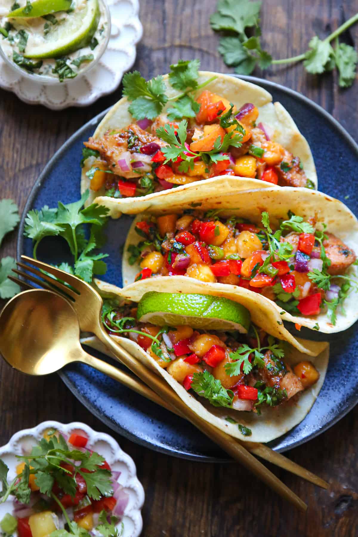Cilantro-Lime Chicken Tacos with Peach Salsa on a blue plate