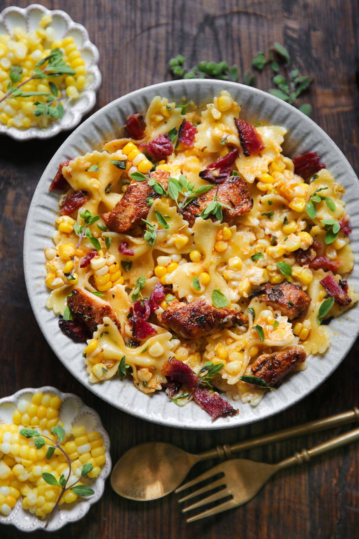 Creamy Chicken and Corn Bow-Tie Pasta with Bacon - on a white plate.