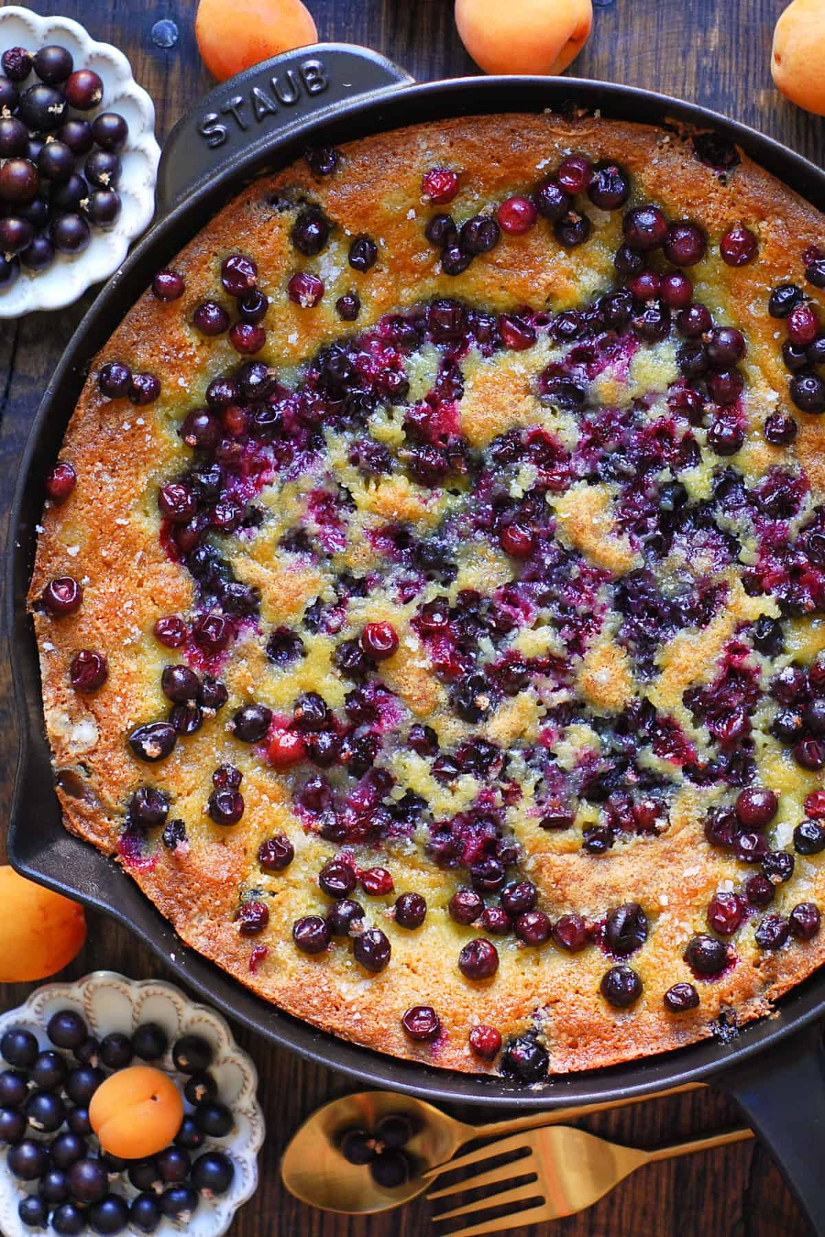 Black currant cake in a cast iron skillet.
