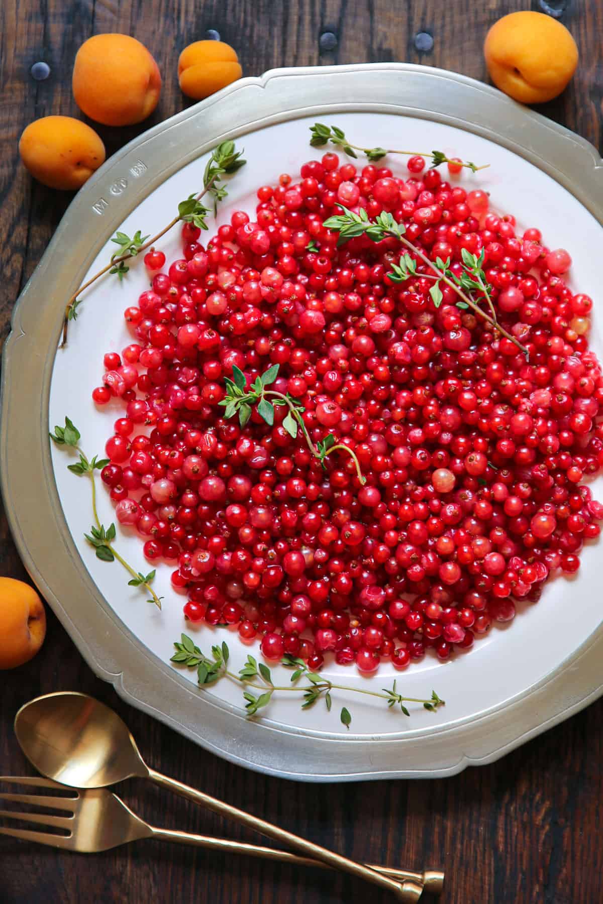 fresh red currants on a large plate.