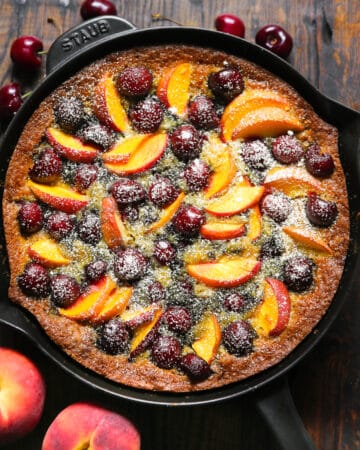 stone fruit cake with peaches and cherries - in a cast iron skillet.