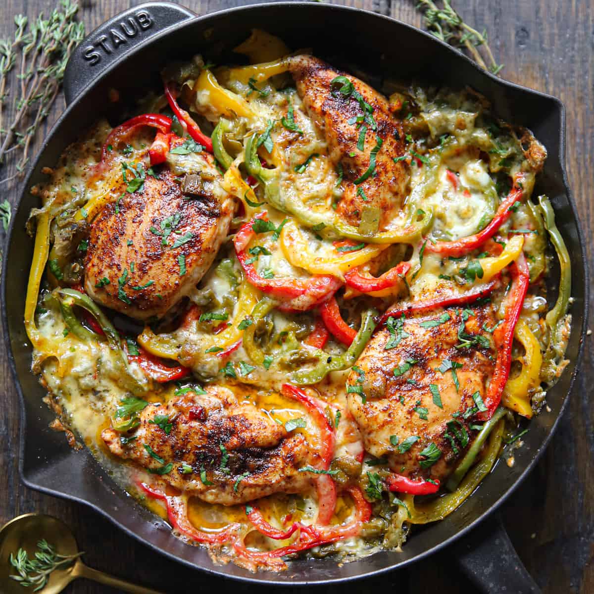 Fajita Chicken Bake with Bell Peppers in a cast iron skillet.