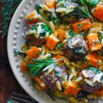 Baked Chicken Meatballs with Creamy Orzo, Roasted Cubed Butternut Squash, and Spinach - on a white plate.
